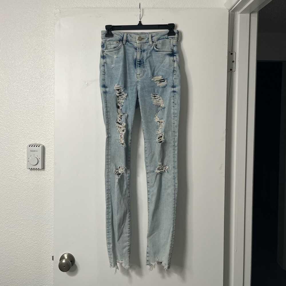Distressed light denim skinny jeans | size 4